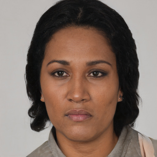 Neutral black adult female with long  black hair and brown eyes