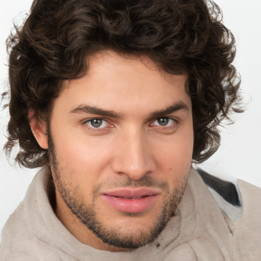 Joyful white young-adult male with medium  brown hair and brown eyes