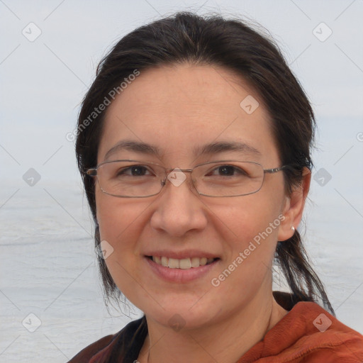 Joyful white adult female with medium  brown hair and brown eyes