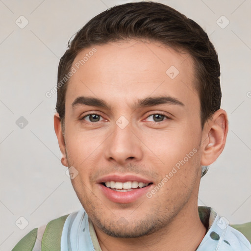 Joyful white young-adult male with short  brown hair and brown eyes