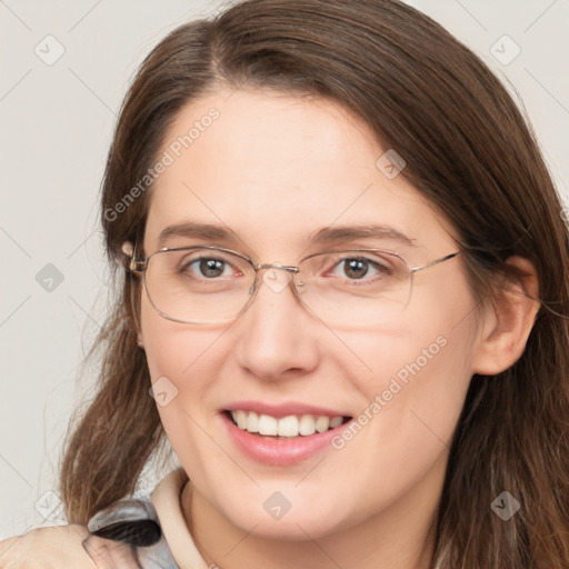 Joyful white adult female with long  brown hair and brown eyes