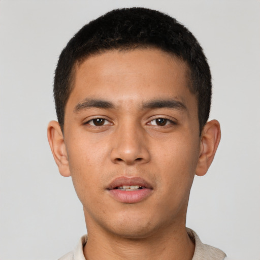 Neutral latino young-adult male with short  brown hair and brown eyes
