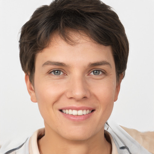 Joyful white young-adult female with short  brown hair and grey eyes