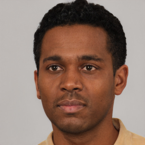 Neutral black young-adult male with short  black hair and brown eyes