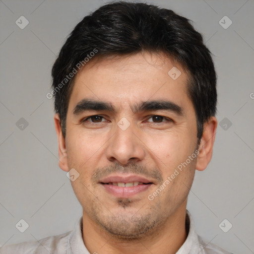 Joyful white young-adult male with short  black hair and brown eyes