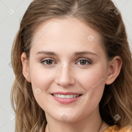 Joyful white young-adult female with long  brown hair and green eyes