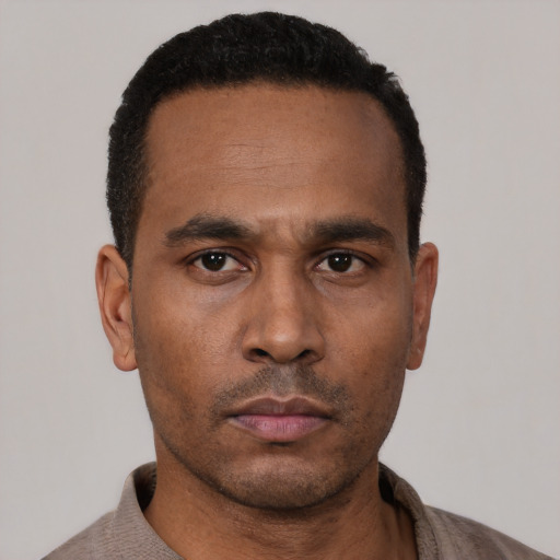 Neutral latino adult male with short  black hair and brown eyes