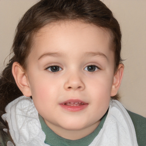 Joyful white child female with short  brown hair and brown eyes