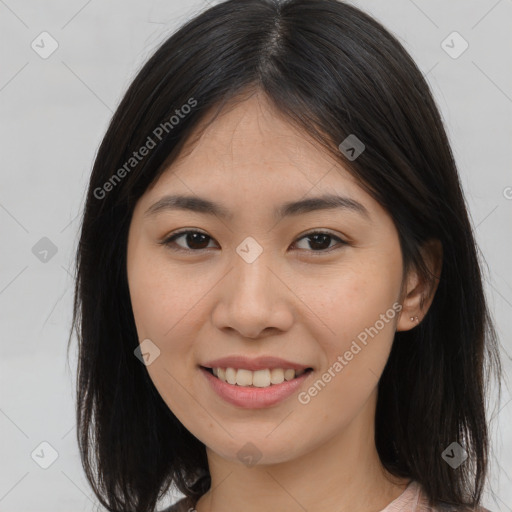 Joyful asian young-adult female with long  brown hair and brown eyes