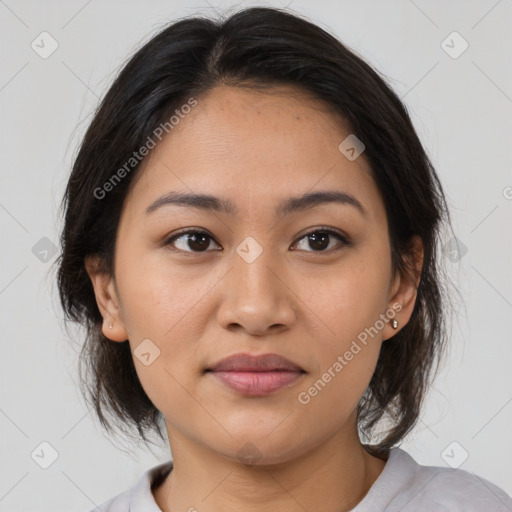 Joyful asian young-adult female with medium  brown hair and brown eyes