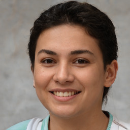 Joyful white young-adult female with short  brown hair and brown eyes