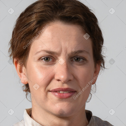 Joyful white adult female with short  brown hair and brown eyes