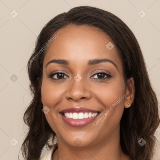 Joyful latino young-adult female with long  brown hair and brown eyes