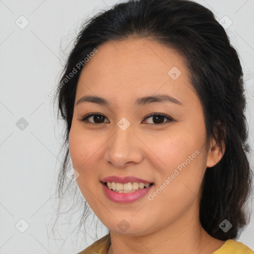 Joyful asian young-adult female with medium  brown hair and brown eyes