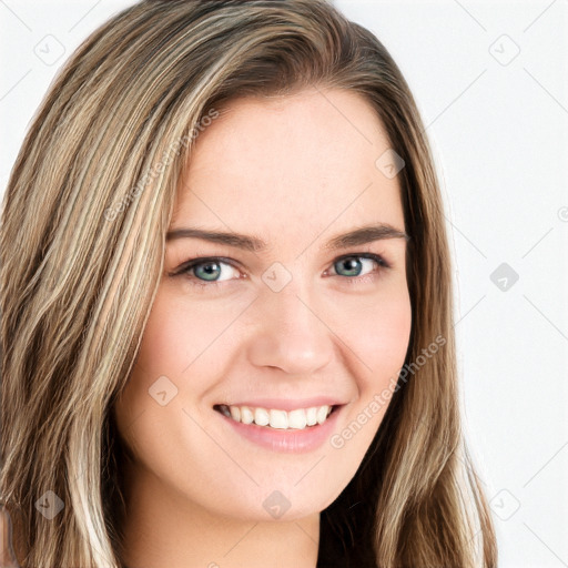 Joyful white young-adult female with long  brown hair and blue eyes