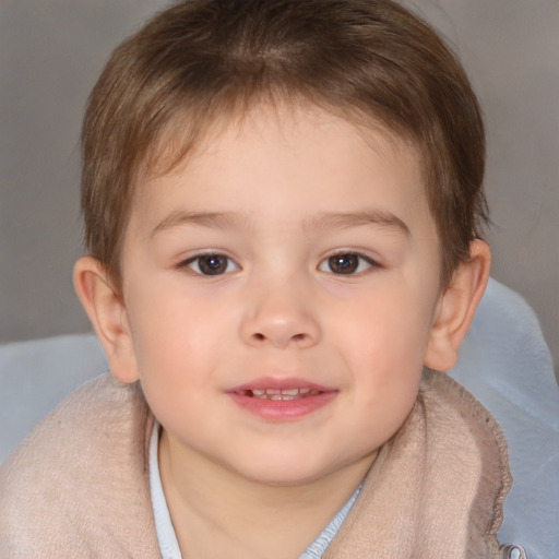 Joyful white child male with short  brown hair and brown eyes