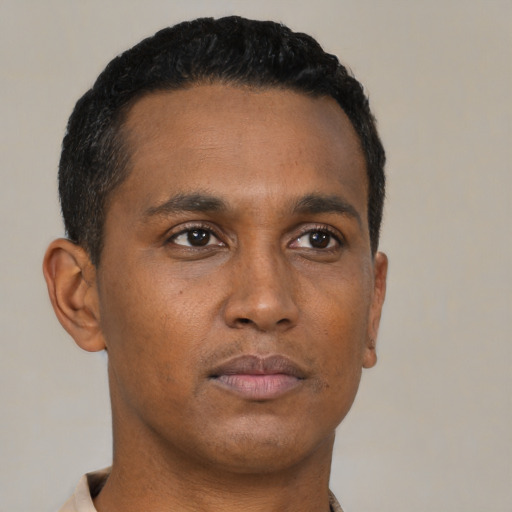 Neutral black young-adult male with short  black hair and brown eyes