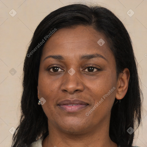 Joyful latino young-adult female with long  brown hair and brown eyes