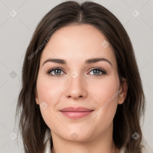 Joyful white young-adult female with medium  brown hair and grey eyes