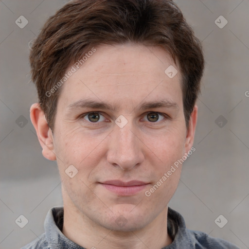 Joyful white adult male with short  brown hair and grey eyes