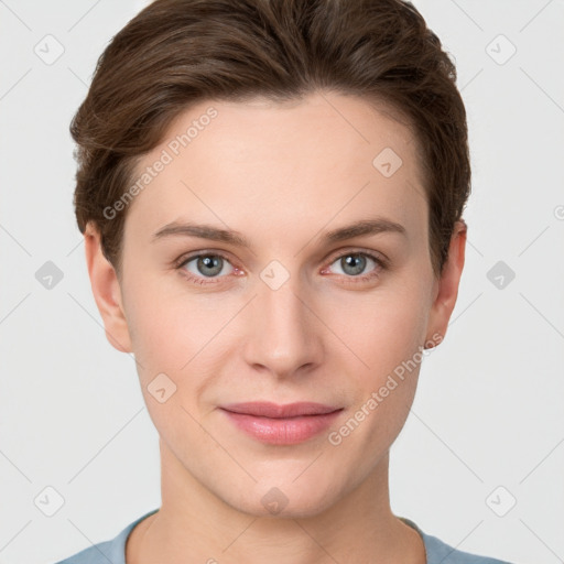 Joyful white young-adult female with short  brown hair and grey eyes