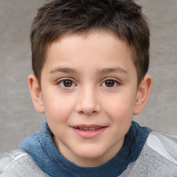 Joyful white child male with short  brown hair and brown eyes