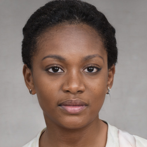 Neutral black young-adult female with short  brown hair and brown eyes