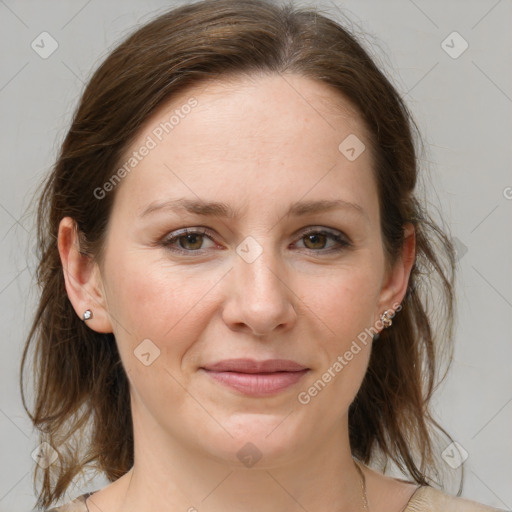 Joyful white adult female with medium  brown hair and grey eyes