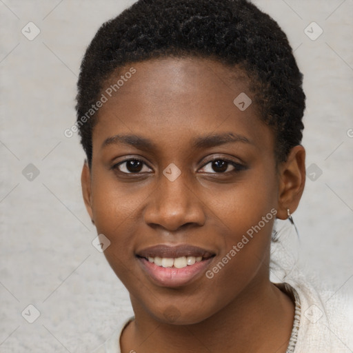 Joyful black young-adult female with short  brown hair and brown eyes