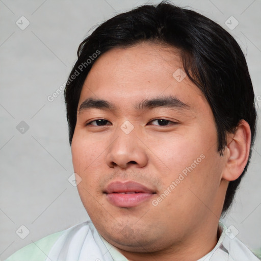 Joyful asian young-adult male with short  black hair and brown eyes