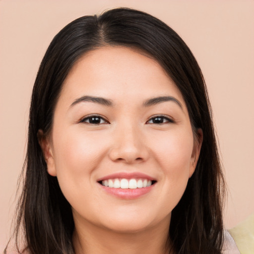 Joyful white young-adult female with long  brown hair and brown eyes