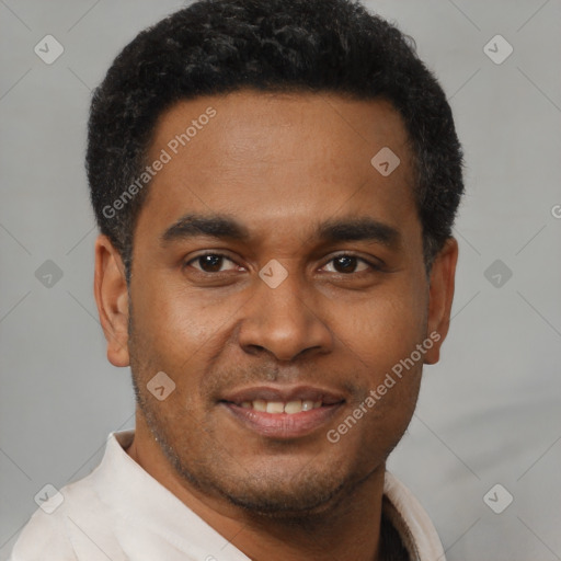 Joyful latino young-adult male with short  brown hair and brown eyes