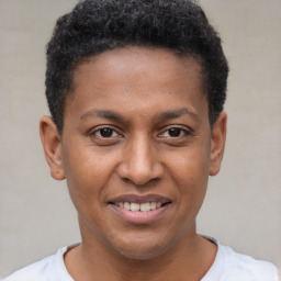 Joyful latino young-adult male with short  brown hair and brown eyes