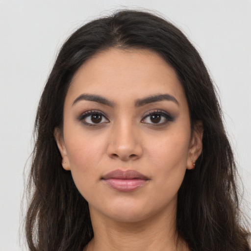 Neutral latino young-adult female with long  brown hair and brown eyes