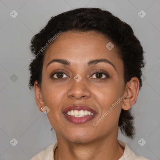 Joyful black young-adult female with short  brown hair and brown eyes