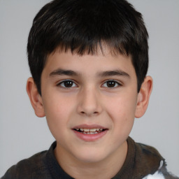 Joyful white child male with short  brown hair and brown eyes