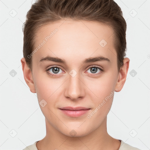 Joyful white young-adult female with short  brown hair and grey eyes