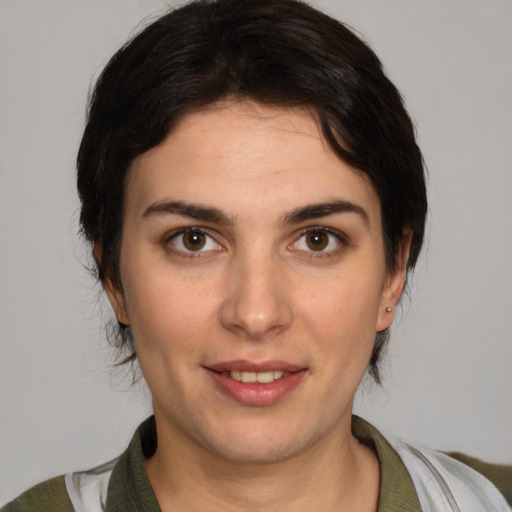 Joyful white young-adult female with medium  brown hair and brown eyes