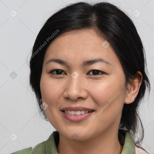 Joyful asian young-adult female with medium  brown hair and brown eyes