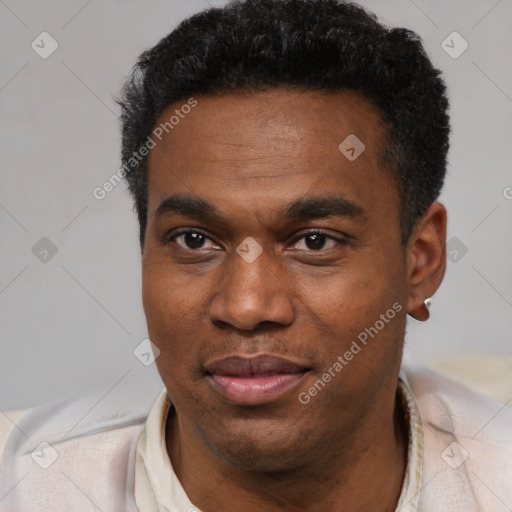Joyful black young-adult male with short  black hair and brown eyes