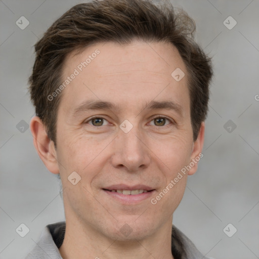 Joyful white adult male with short  brown hair and grey eyes