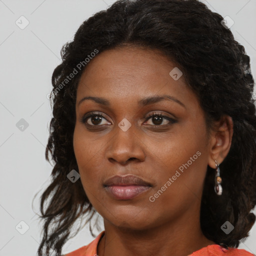 Joyful black young-adult female with medium  brown hair and brown eyes