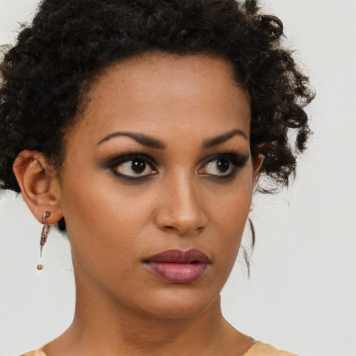 Neutral black young-adult female with short  brown hair and brown eyes