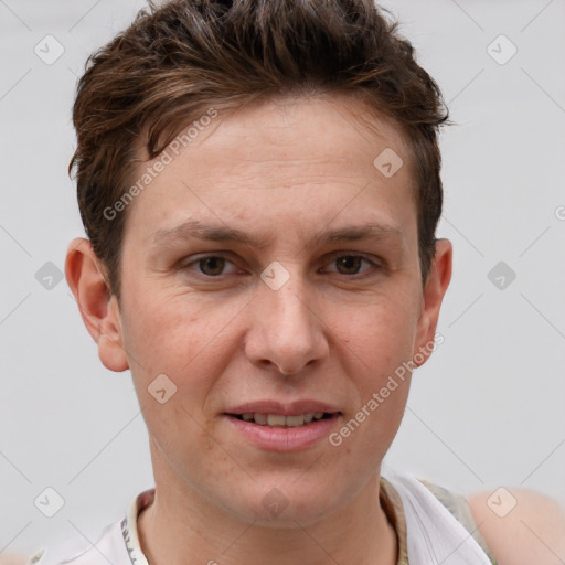 Joyful white adult male with short  brown hair and grey eyes