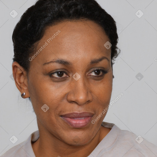 Joyful black adult female with short  brown hair and brown eyes