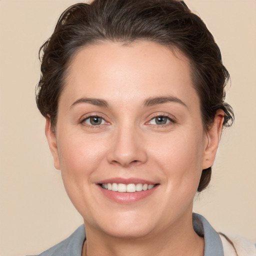 Joyful white young-adult female with medium  brown hair and brown eyes