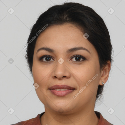 Joyful latino young-adult female with medium  brown hair and brown eyes