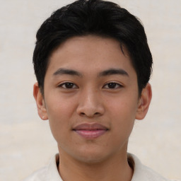 Joyful asian young-adult male with short  brown hair and brown eyes