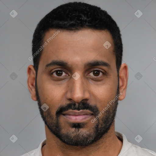 Joyful black young-adult male with short  black hair and brown eyes