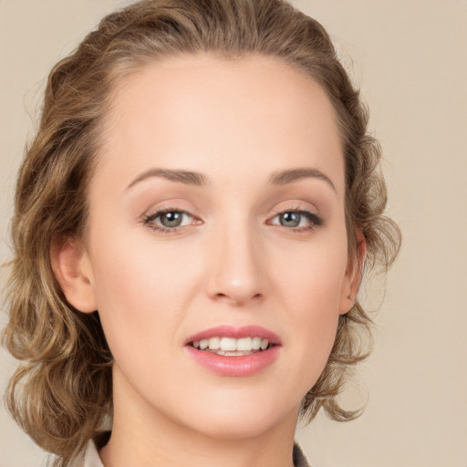 Joyful white young-adult female with long  brown hair and green eyes